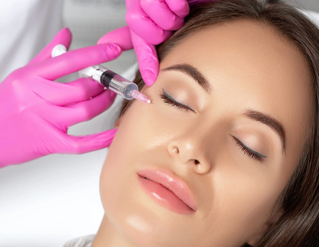 Close-up of a cosmetic facial injection near the eye, representing dermal fillers
